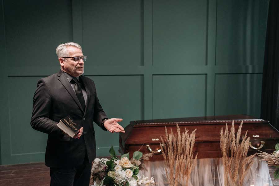 Funeral director speaking during a service